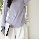 Knitted sweater in fake two-piece style with color-blocking splicing