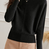 Round-neck sweater with cuffed hem.