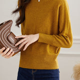 Round-neck sweater with cuffed hem.