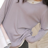 Knitted sweater in fake two-piece style with color-blocking splicing