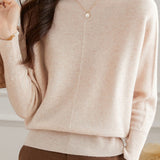 Round-neck sweater with cuffed hem.