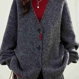 Knitted cardigan with contrast color single-row buttons.