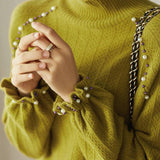 Elegant beaded high - neck knitted sweater