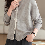 Lace-trimmed short knitted cardigan