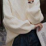 Half turtleneck loose knitted sweater