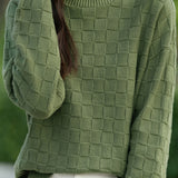 Half turtleneck solid-color sweater with square decorations