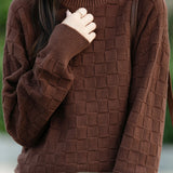 Half turtleneck solid-color sweater with square decorations