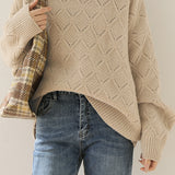 Round-neck hollowed-out knitted sweater