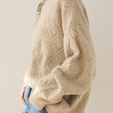 Round-neck hollowed-out knitted sweater