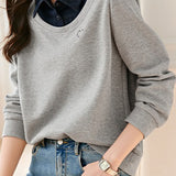 Elegant fake two-piece spliced color-block top