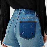 High - waisted denim shorts with frayed edges