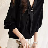 V-neck spliced knitted shirt