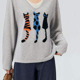 Fake two - piece long - sleeved cat - pattern knitted sweater.