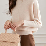 Round-neck sweater with cuffed hem.