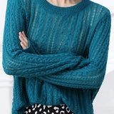 Hollowed-out knitted blouse