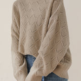 Round-neck hollowed-out knitted sweater