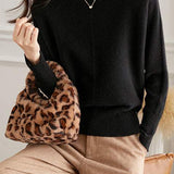 Round-neck sweater with cuffed hem.