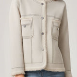 Chanel - style low - round - neck fashionable jacket.