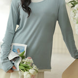 Knitted sweater in fake two-piece style with color-blocking splicing