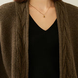 Buttonless cable-knit cardigan